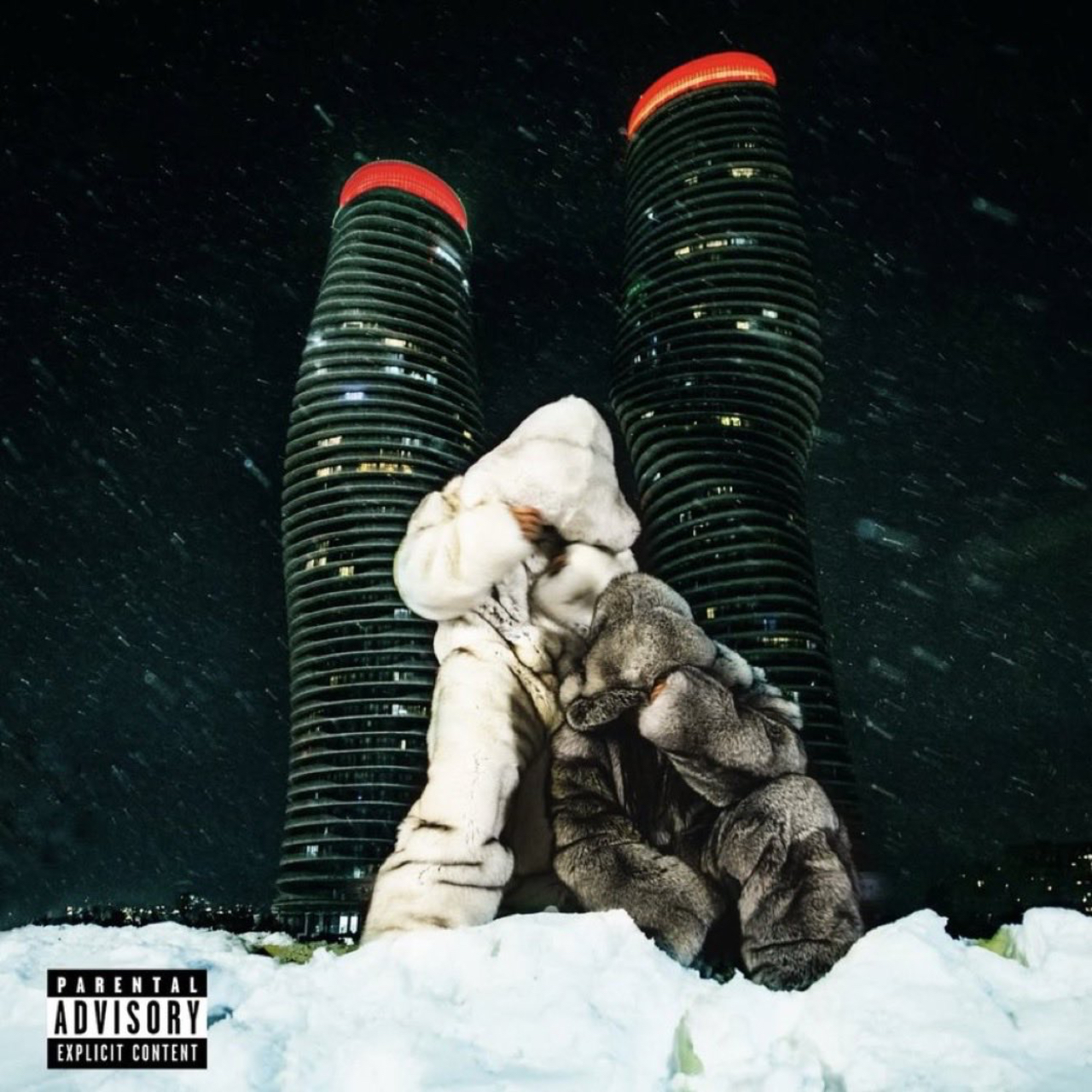 Two people in fur coats in front of two tall, illuminated towers at night, with snow on the ground and a parental advisory label.